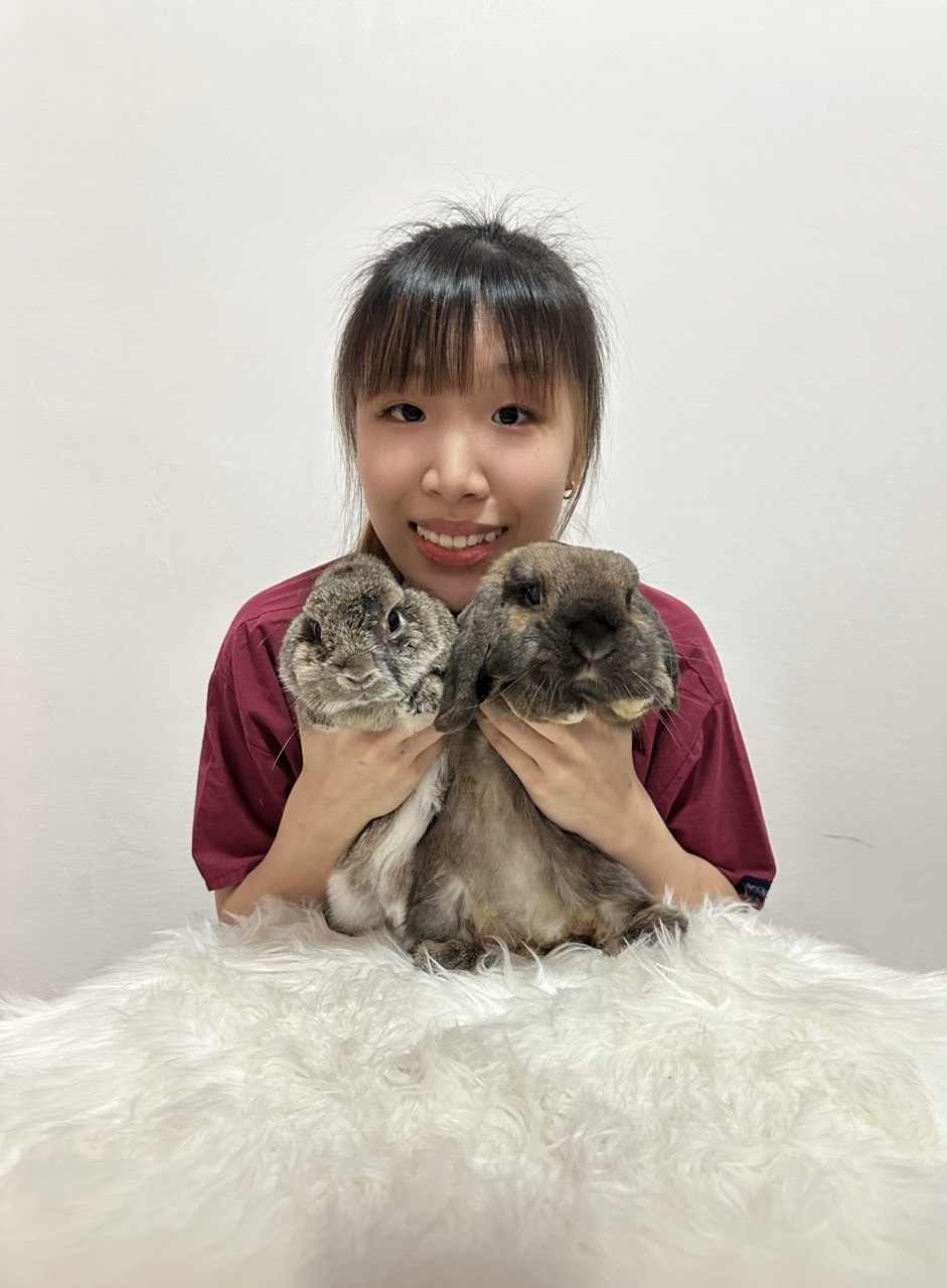 Cherie holding two rabbits
